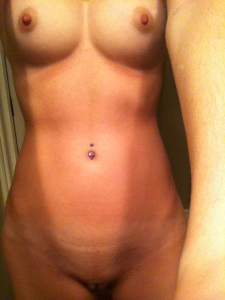 Belly button piercing with tight