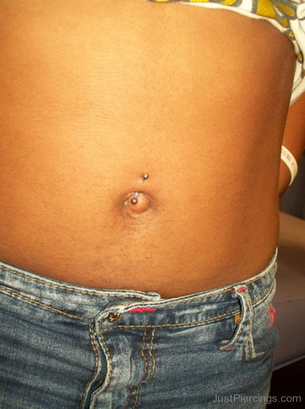 Belly button piercing with tight